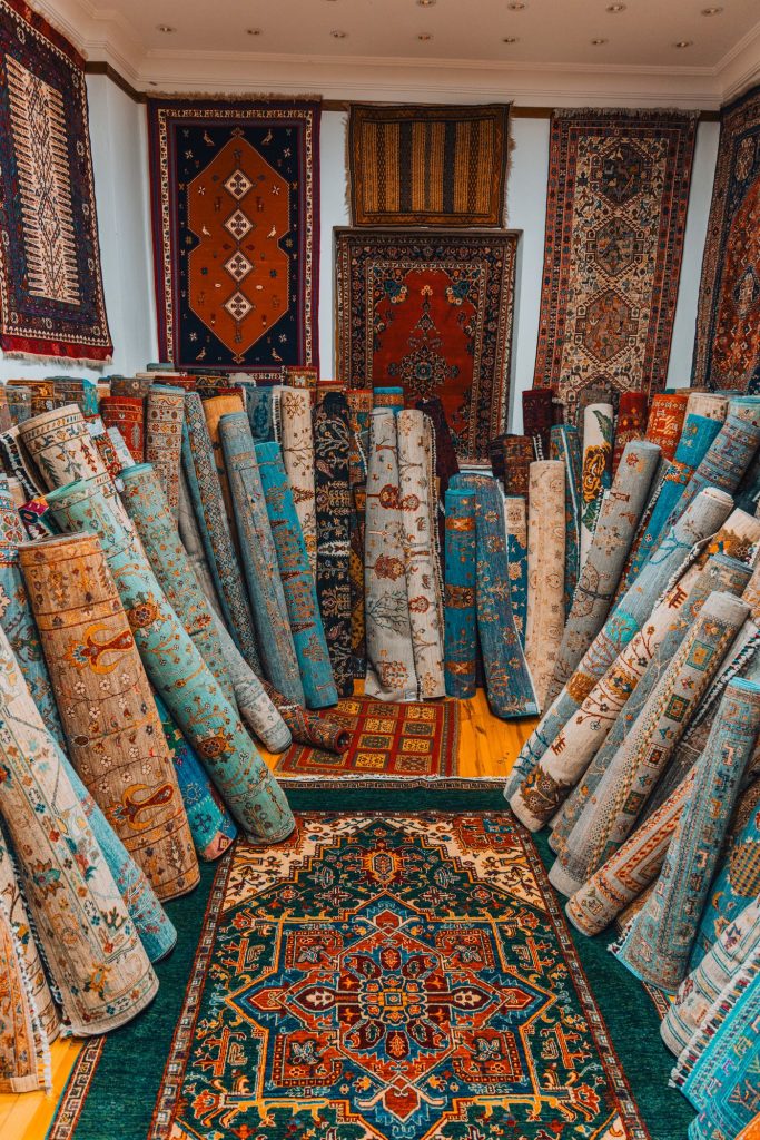 Colourful traditional rugs displayed in a showroom